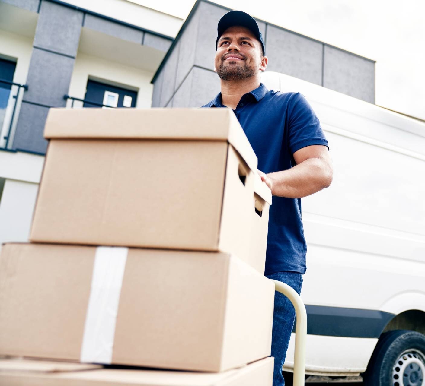 House movers and packers wrapping furniture in an Abu Dhabi home