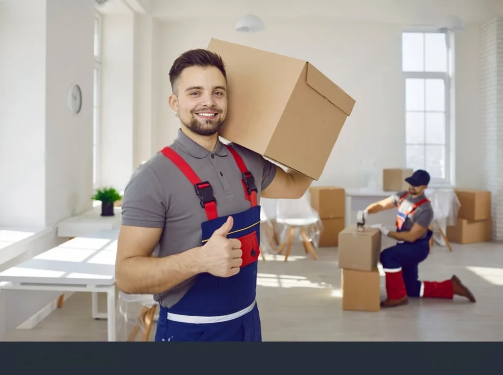 Professioanl movers and packers holding a packed box